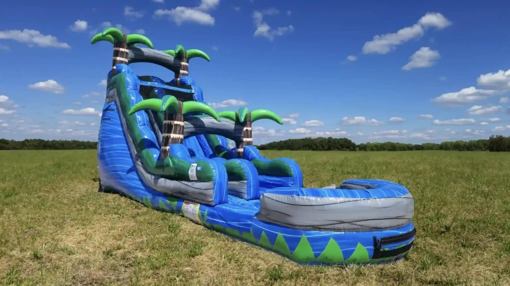 Blue Crush 18 foot water slide on a lawn